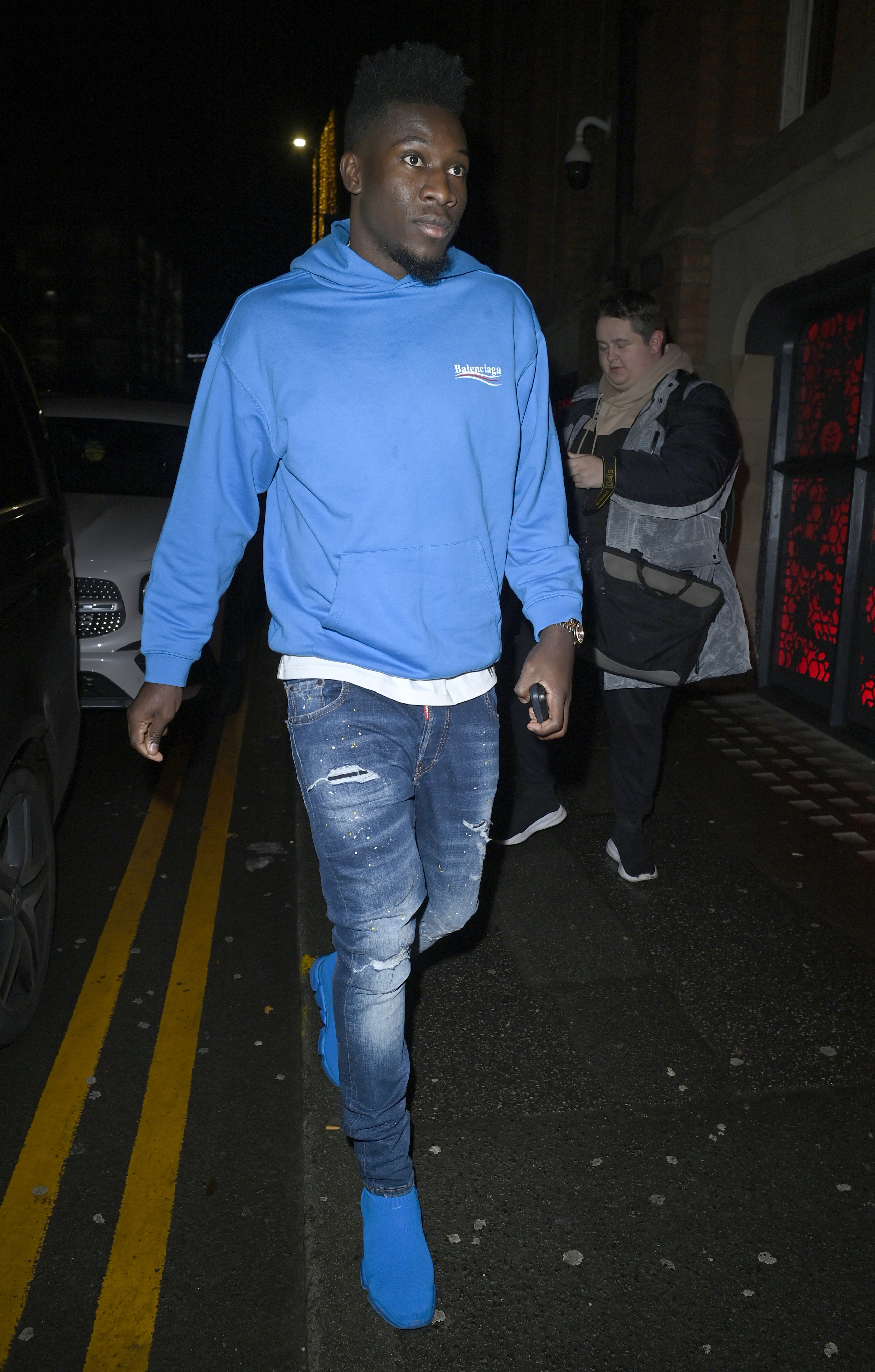 Andre Onana wore a blue Balenciaga hoodie and matching trainers