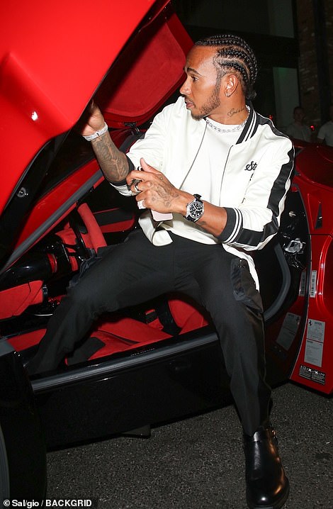 Wowza! Lewis Hamilton showed off his wealth as he took his $1.2 million (£1million) Ferrari car out for a spin