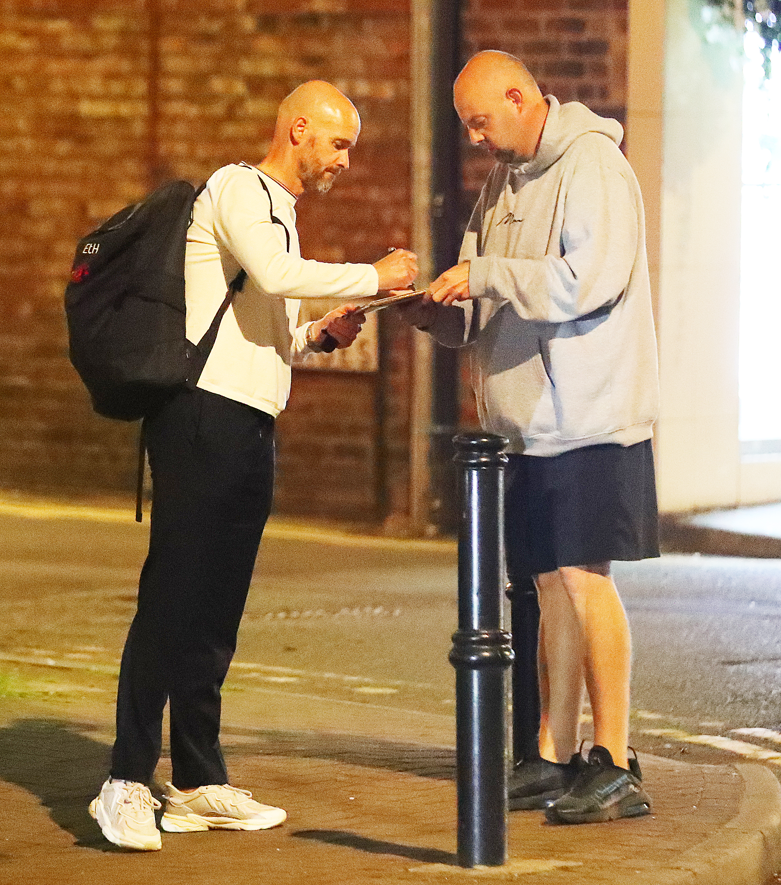 The Manchester United boss stopped to sign an autograph outside the restaurant