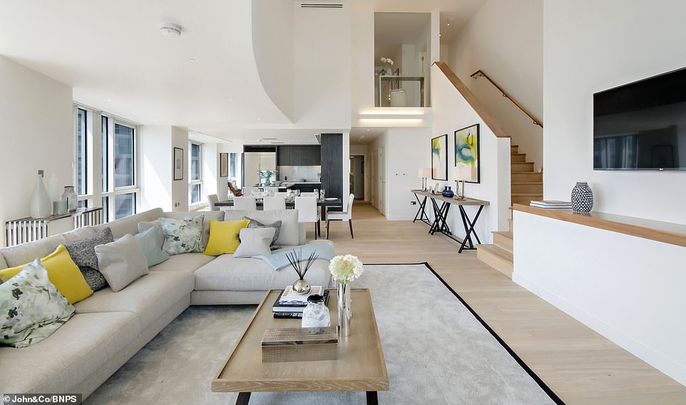 Pictured, the open-plan living area at a penthouse that was formerly the home of Andy Carroll, Patrice Evra and Jose Fonte, all of whom played at West Ham United