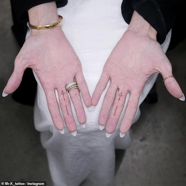 Last year in August, she initially debuted mystery ink on each of her middle fingers - which had been done by tattoo artist, MR.K