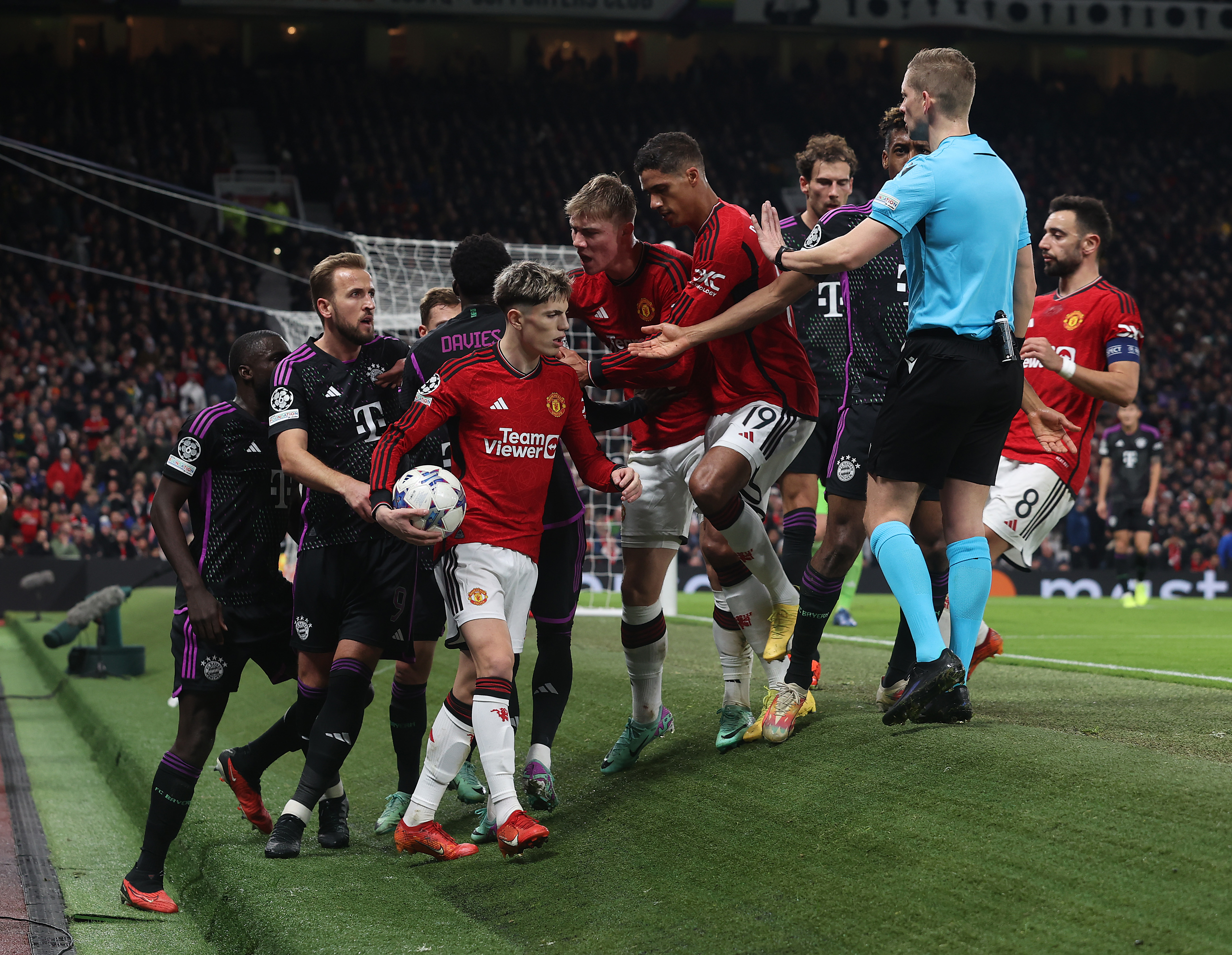 The England captain was separated from the United winger after Kingsley Coman was bundles into the pitch side hoardings