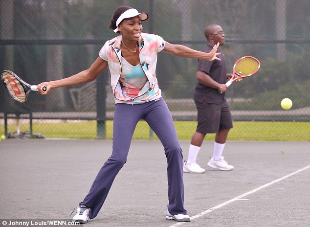 Doing her bit: Serena's sister Venus met aspiring young tennis players through the charitable organisation First Serve Miami (FSM) in Miami