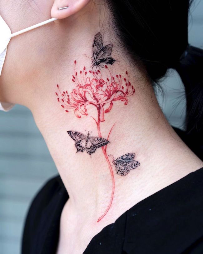 Butterfly and chrysanthemum tattoo by @oozy_tattoo