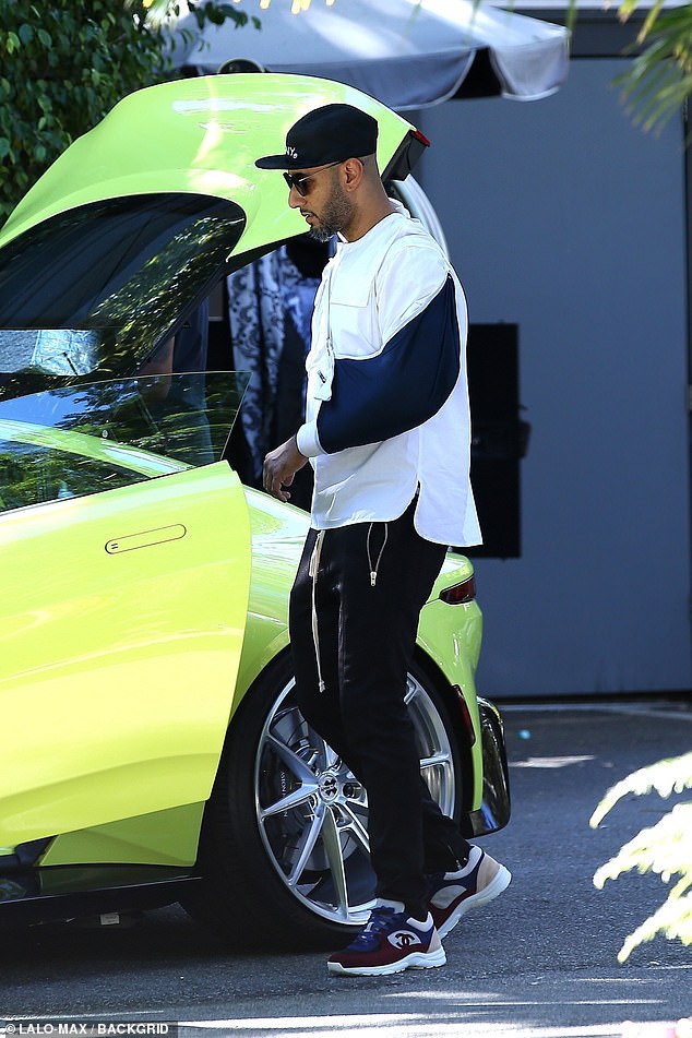 What happened? Swizz was seen with his neon dream of a car on Saturday in Bel Air, where he sported an arm sling