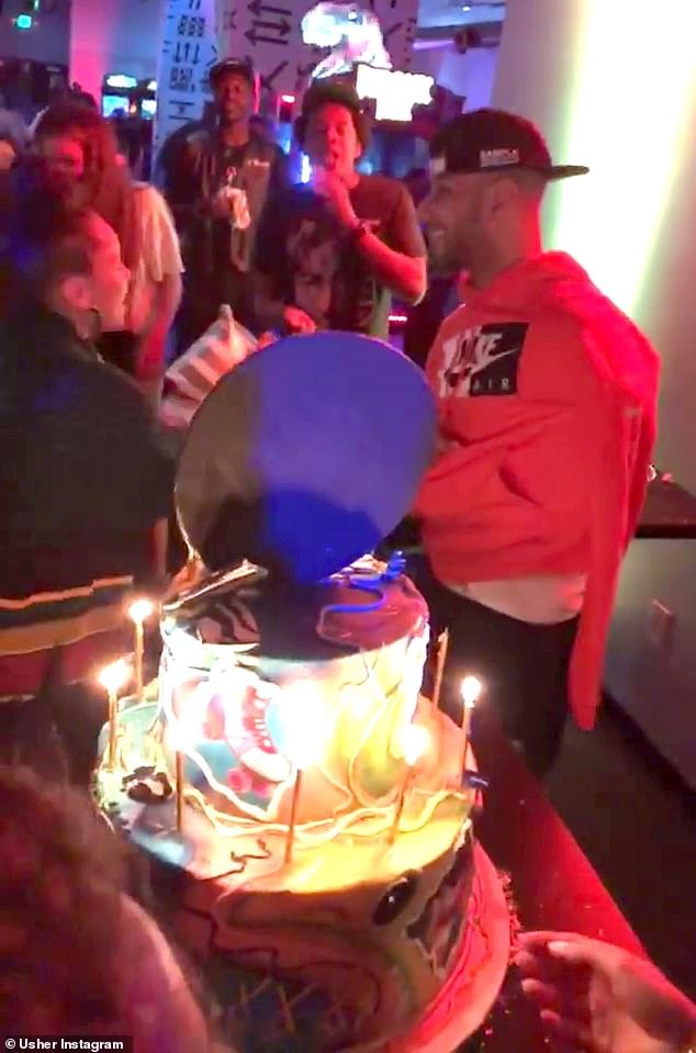 Happy Birthday: He also shared a brief video where Alicia, Jay-Z and many others sang 'Happy Birthday' to Swizz in front of a huge cake