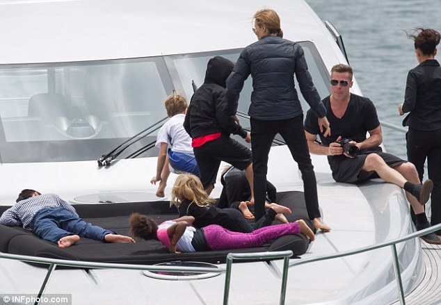 Family portrait: Brad Pitt snaps fiancee Angelina Jolie and their children whilst on board a luxury yacht in Sydney, Australia on Friday