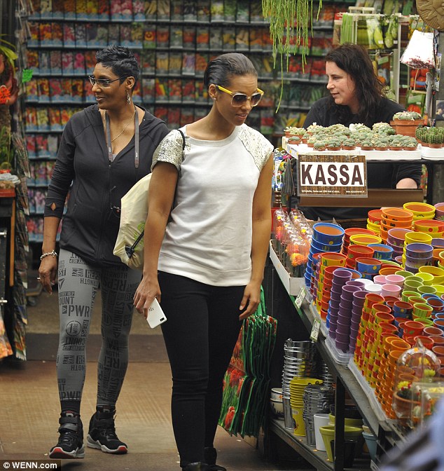 New sights and smells: Alicia and her mom explored a flowers market, looking quite taken by what they saw