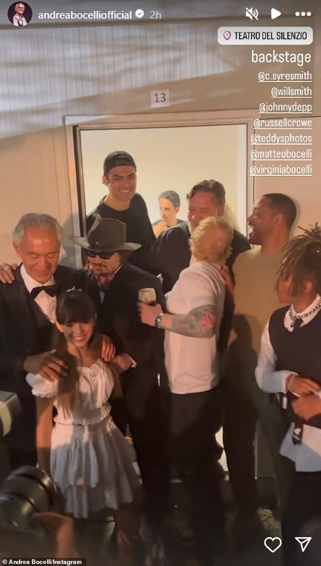 Depp joined the group backstage and was seen saying something inaudible in Andrea's ear, following their moving performance earlier in the evening, which also served as a tribute to the actor's late friend and collaborator Jeff Beck .