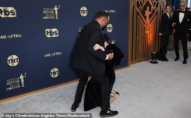 Shocked: Jeff Goldblum and his wife Emile Livingston looked concerned as they reacted to the fall several feet away