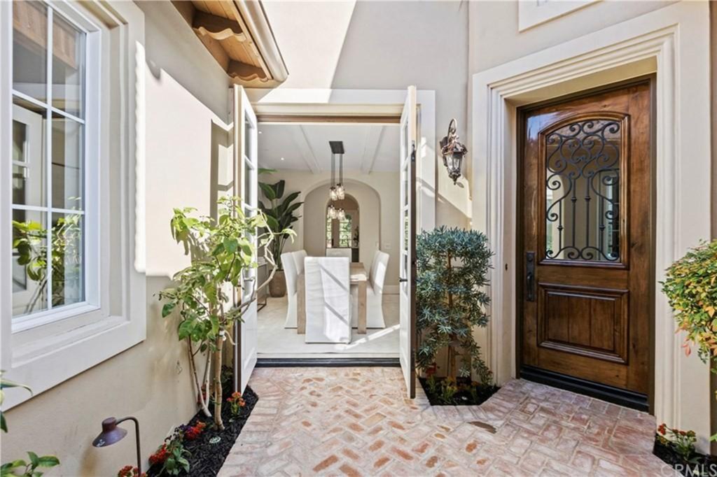 The yard leads to swinging french doors that open into the formal dining area. 