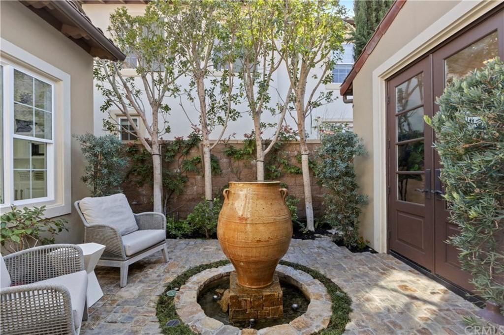 A elegant courtyard with planted trees. 